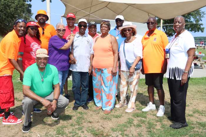 Rt. Hon. Glenver Jones, center, in white shirt, with Committee Members.