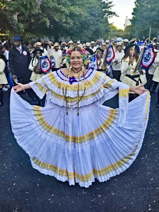 A proud Panamanian displays a pollera outfit during the 2024 parade.