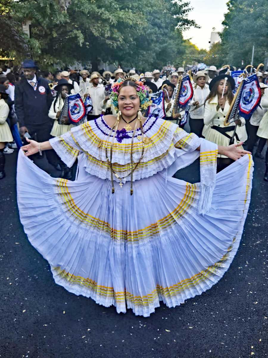 A proud Panamanian displays a pollera outfit during the 2024 parade.