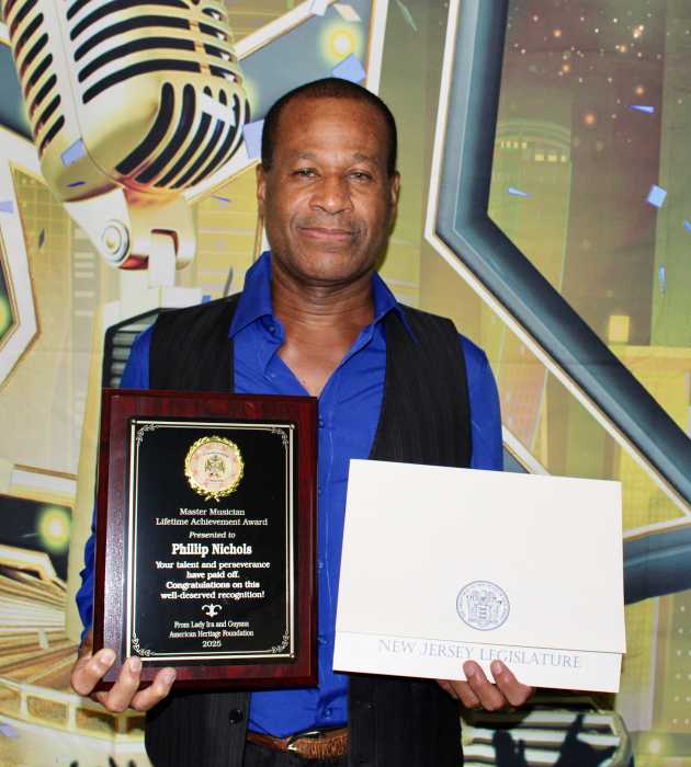 Musical arranger and keyboardist, Phillip Nichols, after being awarded the Master Musician Lifetime Achievement Award, on Sept. 14, at the Musician Appreciation Awards at the. Waterfall Lounge, on Church Avenue, Brooklyn.