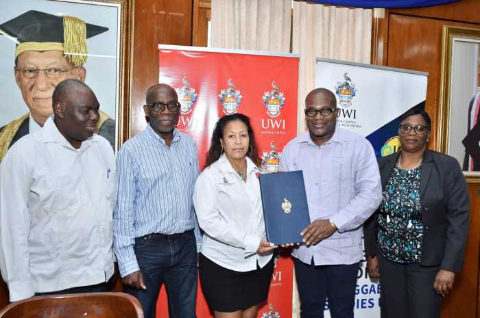 From left, Dr. Donovan Stanberry, campus registrar, UWI Mona; Dr. Dennis Howard, lecturer and coordinator, Entertainment and Cultural Enterprise Management program; Ms. Michelle Williams, regional director, Caribbean, Latin America and Oceania Market, VP Records, Professor Densil A Williams, principal and pro-vice chancellor, UWI Mona and Dr. Deon Edwards-Kerr, dean, Faculty of Humanities and Education.