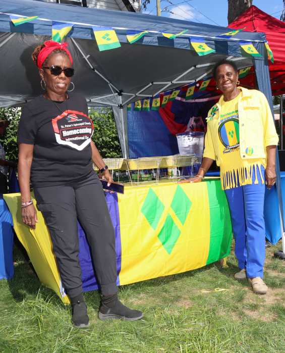 Trinidadian Monica Carrington, left, and Vincentian Barbara McDowall at the Vincentian tent.