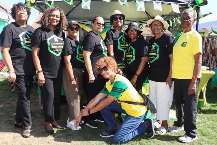 Jamaicans assemble before their tent.