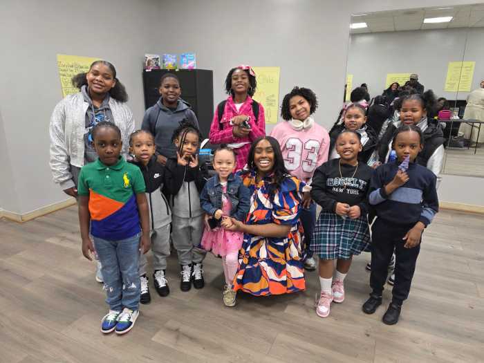 The cast of “The Child” with Aminiqué Kirnon, a Canarsie, Brooklyn educator.