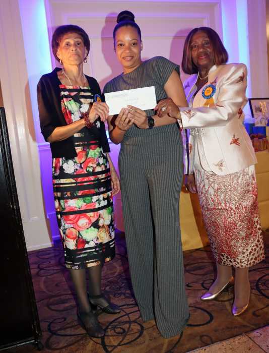 Rosemary Guzman, center, receives scholarship award, flanked by Dr. Virginia Bernard, RN, president of the Bronx, Manhattan and Westchester Chapter of the Caribbean American Nurses’ Association, Inc. (CANA), right; and Lorna Ferriera, RN.