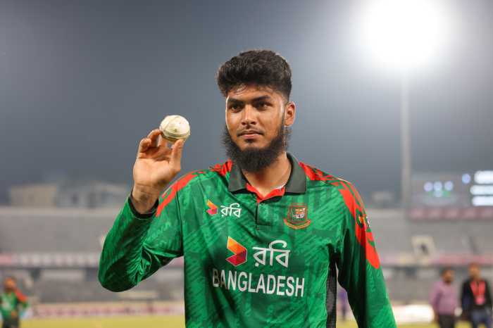 Bangladesh's Rishad Hossain poses with the 'player of the match' trophy at the end of the first One-Day International (ODI) cricket match between Bangladesh and West Indies at the Sher-e-Bangla National Cricket Stadium in Dhaka, Bangladesh, on Oct. 18, 2025.