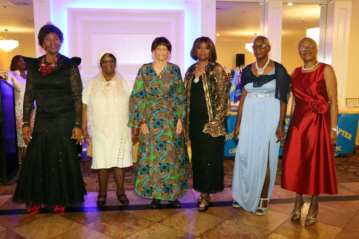 Models assembly after strutting their outfits.