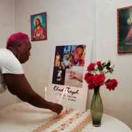 Lynette Burnley, aunt of Chad Joseph, who family members believe was killed in a U.S. military strike on a boat in the Caribbean, lights a candle at an altar for Joseph in the family home in Las Cuevas, Trinidad and Tobago, Oct. 22, 2025.