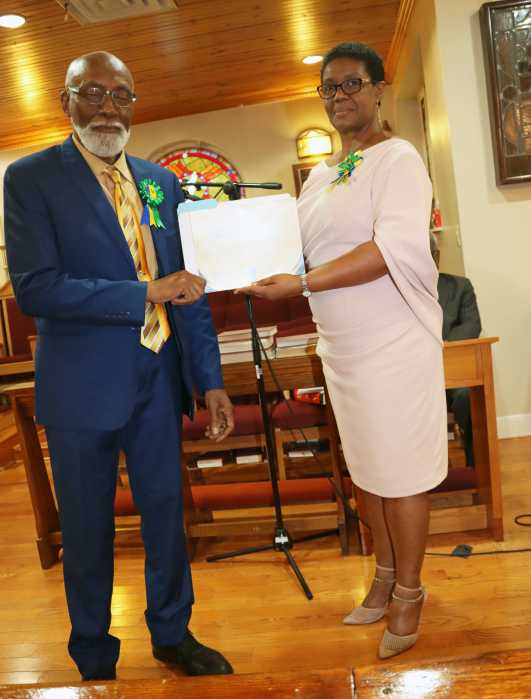 Ambassador Lou-Anne Gilchrist presents Certificate of Recognition to Crispin Friday, president of the Brooklyn-based Vincentian umbrella organization in the US, Council of St. Vincent and the Grenadines Organizations, U.S.A., Inc. (COSAGO) during an Ecumenical Service of Thanksgiving, organized by COSAGO in conjunction with the SVG Consulate General to the US, at St. Alban's Episcopal Church in Canarsie, Brooklyn, marking St. Vincent and the Grenadines 46th Anniversary of Independence.