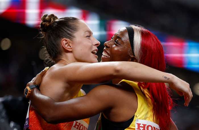 Jamaica's Shelly-Ann Fraser-Pryce celebrates winning the silver medal with bronze medallist Germany's Gina Luckenkemper at the World Athletics Championships Tokyo 2025 in the Women's 4 x 100m Relay Final at the Japan National Stadium, Tokyo, Japan on Sept.21, 2025.