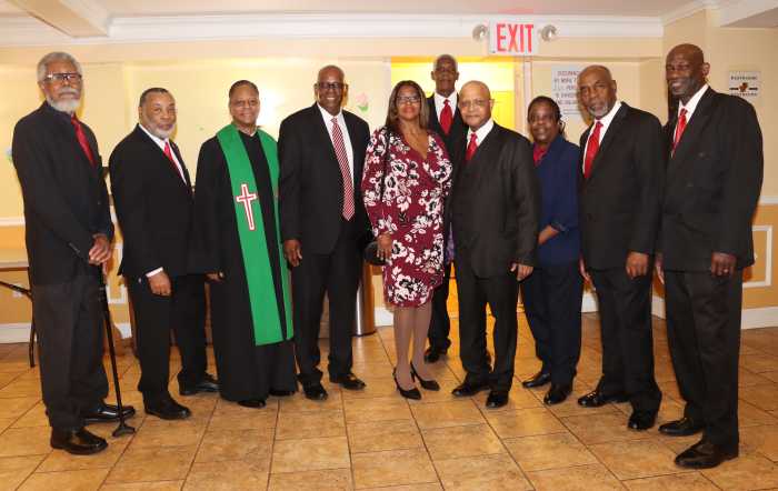 Rev. Lawrence Craig, third from left; Pastor the Rev. Roger Jackson, fourth from left; First Lady, Sis. Kim Jackson, fifth from left; Sis. Herline Florival, organist; and some members of FSUMC Men's Group after Worship Service.