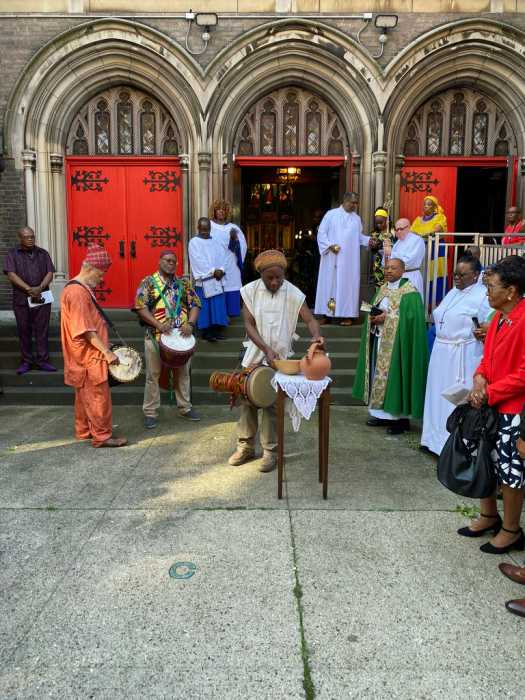 An African ritual being performed outisde the St. Paul's Church, Flatbush, Brooklyn.