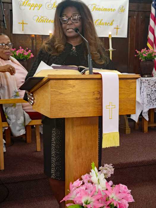 Guyanese-American Justice Claudia Daniels-DePeyster addresses congregation at Fenimore Street United Methodist Church on Oct. 5. Liturgist Min. Cynthia Grant is in background.