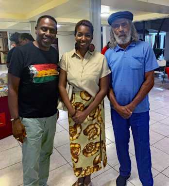 Celebrated Jamaican footballer player and cultural figure Allan 'Skill' Cole (R) sharing lens time with Louis Grant (Irie Jam Radio, NY) and Niambe McIntosh, daughter of reggae icon Peter Tosh, at the annual Peter Tosh Symposium in Kingston, Jamaica on Oct. 16, 2024.