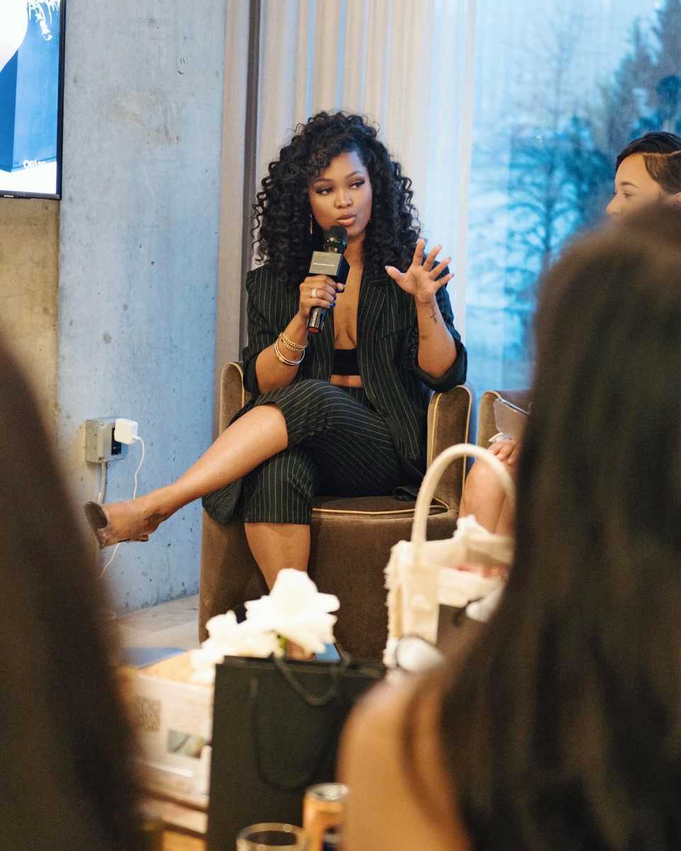 Kadeisha Placide delivers a motivational speech at her Women in Power Collective event, inspiring high-achieving women to embrace self-awareness, confidence, and purpose-driven growth.