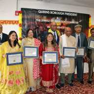 Queens Borough President Donovan Richards Jr. hosted a spirited Diwali celebration at the Kissena Hindu Center in Queens, and presented Citation of Honor to community leaders who have made significant contributions throughout the borough. From left are Dr. Vipul Patel, Sami Sarkar, Guyanese-born Dr. Sharla Madho-Khargi, Dr. Shreeya Tuladhar, Queens Borough President Donovan Richards Jr. (in back), Nagasser Ramgarib, Ashif Ahmed, and Rasik Sanghavi. The event was held on Oct. 16.