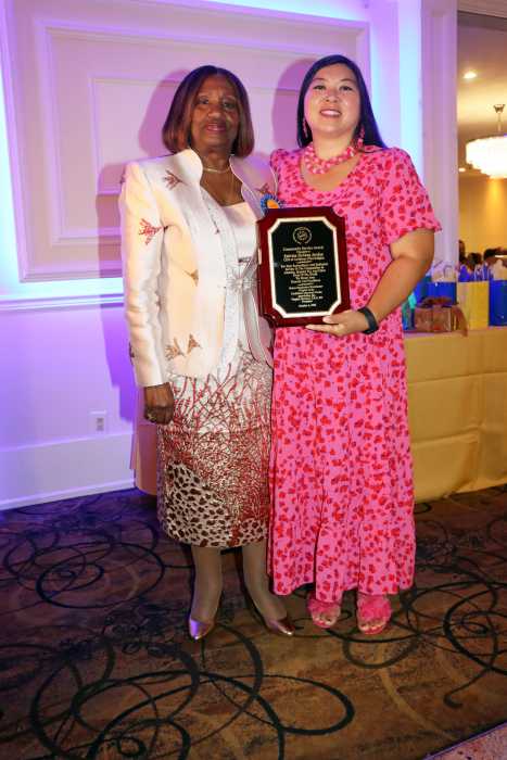 Sabrina HoSang Jordan, right, receives award from CANA Bronx, Manhattan, Westchester Chapter Jamaican-born President Dr. Virginia Bernard, RN.