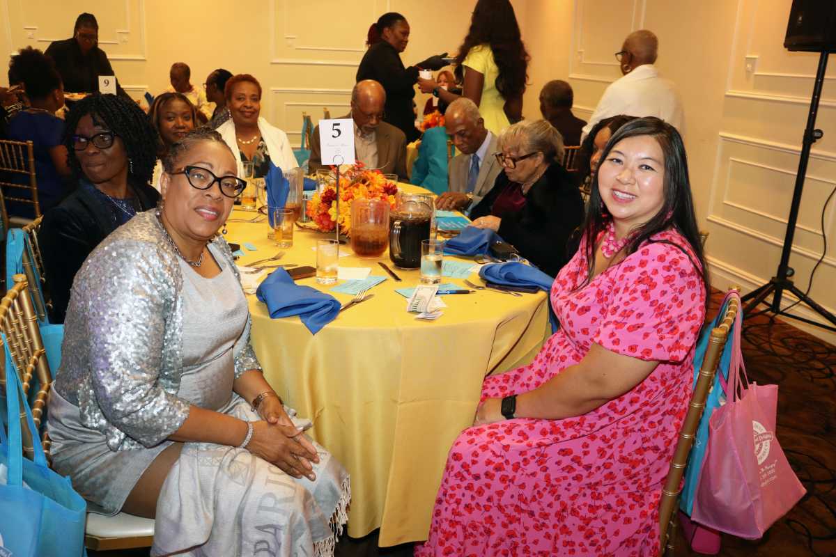 Sabrina HoSang Jordan, front right, with supporters at her table.
