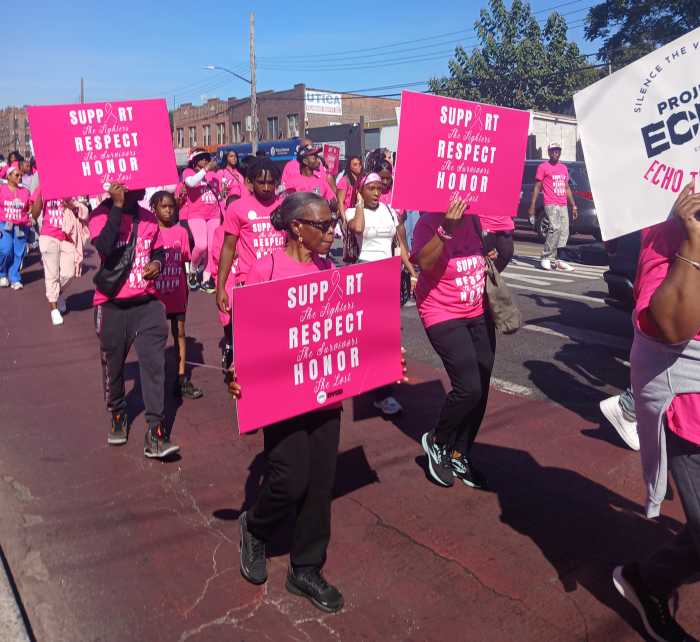 A group of supporters walking along Utica Avenue in Brooklyn.