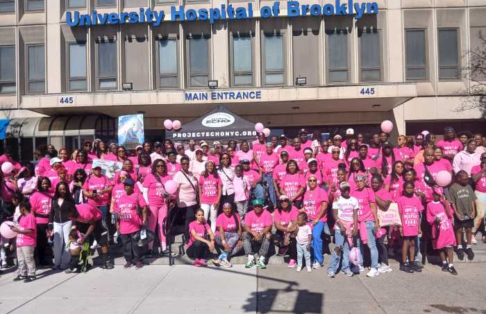 Supporters and survivors standing of breast cancer awareness in front of SUNY Downstate Medical Hospital, among them are Assemblymember Monique Chandler-Waterman, representing the 58th District in Brooklyn and Rita Josephs, NY City Council Member of the 40th District, both standing in center of photograph.