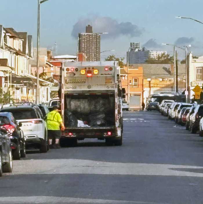 A Department of Sanitation truck collects compost in Queens as part of the citywide effort to reduce rat populations and keep streets cleaner.