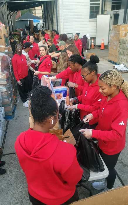 Track & Field Athletes of St. John's University in Queens, volunteered diligently on Saturday, Sept. 27, 2025 - "University Service Day" at the newly branded Community Food Pantry Inc. in Richmond Hill. The ladies and coaches volunteered, bagging and serving nutritious meals to hundreds of residents in two sessions.