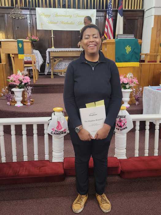 Jacqueline Hopkins with music sheets after world premiere of The Jacqueline Hopkins Choir at FSUMC.