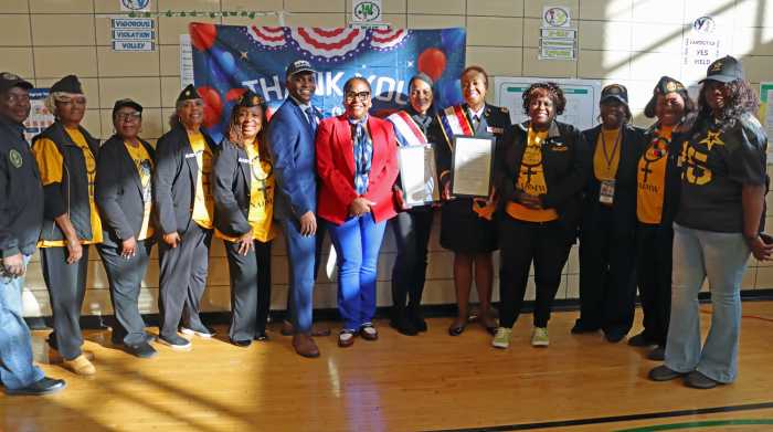 New York State Assembly Member Stefani L. Zinerman, center, NYC Department of Veterans' Services Commissioner James W. Hendon, to her immediate right, and Community Board service members.