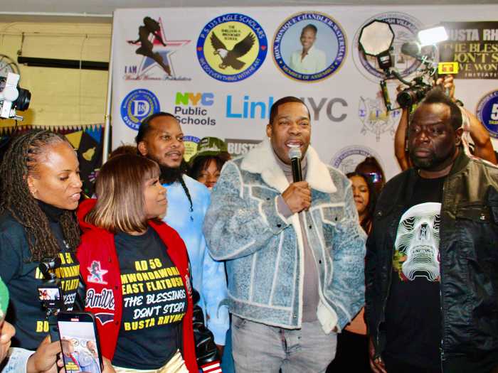 The Blessing Don't Stop singer, and Grammy recording artist Busta Rhymes, called on residents of East Flatbush to love and uplift each other during a turkey giveaway on Nov. 22, 2025, at PS 135 Sheldon A. Brookner High School, at 684 Linden Blvd. in Brooklyn. This was done in partnership with Assembly Member, District 58 Monique Chandler-Waterman, I Am Wonda Woman, and others. From left are Assembly Member Monique Chandler-Waterman, Dr. Meda Leacock, rapper, Special ED, Busta Rhymes, and Chop Suey.