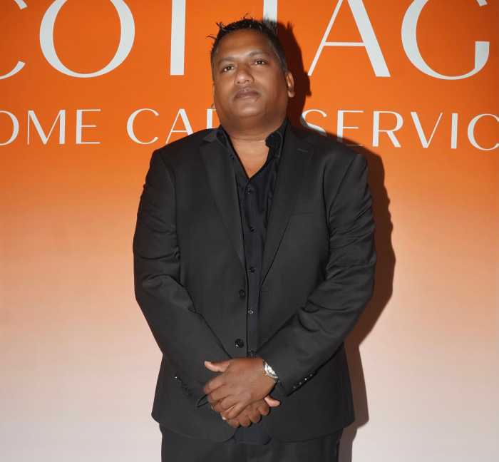 Cottage Home Care Services CEO Navin Shivpal speaks at the grand opening of the company’s new Flatbush Avenue branch, celebrating the agency’s rapid growth and commitment to culturally competent care.