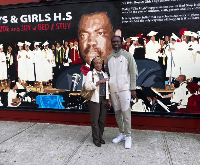 Sharon Rose-Calhoun (left), cousin of Dr. Frank Mickens, with Community organizer and The C.U.R.E. R.A.T.E.R. nonprofit founder, Vaughn Jefferson (right), who commissioned the Dr. Frank Mickens mural.