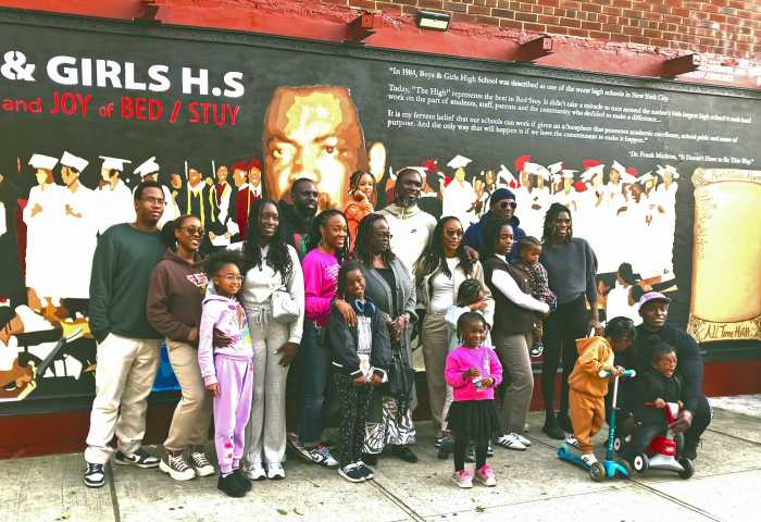 Community photo including attendees celebrating the Dr. Frank Mickens mural dedication.