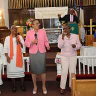 The Praise & Worship Team gets the spirit of the Lord flowing, as pastor, the Rev. Roger Jackson, joins from the pulpit.