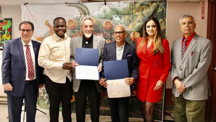 Elected officials on Nov. 15, presented accolades to two humanitarians at the year-end Queens Book Festival & Literary Festival, Inc. and the NYC office of Adult & Continuing Education at the Queens Library in Richmond Hill. From left are representative from Assembly Member David Weprin's office Anthony Lemma, Council Member Kaleel Anderson, honorees Swami Durga Das of the River Fund Pantry, Tony Singh of the Community Pantry, Assembly Member Jenifer Rajkumar, and Dr. Dhanpaul Narine, founder of Queens Book Fair & Literary Festival Inc.