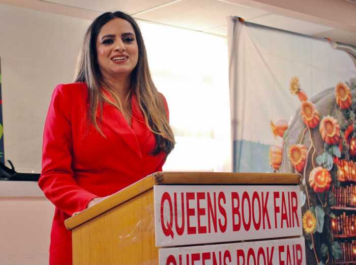 Assembly Member Jenifer Rajkumar, addresses a packed audience at the year-end Queens Book Festival & Literary Festival, Inc. and the NYC office of Adult & Continuing Education, Giving Thanks event at the Queens Library in Richmond Hill, Queens on Nov. 15, 2025.