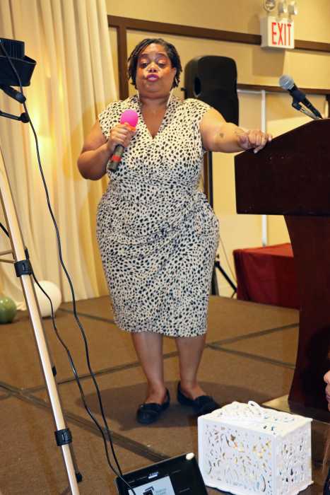 Evangeline Soleyn-John, fourth daughter, reads her mom's biography.