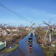 Drone view of vehicles driving along a flooded road, in the aftermath of Hurricane Melissa, in Black River, Jamaica, Nov. 2, 2025.