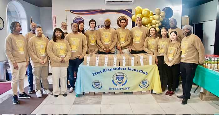 Members and officers of the First Responders Lions and Leos clubs pose for a photo in Liberty Bible Fellowship Church lobby, after prayers. They distributed pre-Thanksgiving pies to worshipers on Nov. 17, 2025.