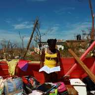 Andrieneke Hyman, 13, looks at her wet notebook in her damaged room, in the aftermath of Hurricane Melissa, in Auchindown, Saint Elizabeth Parish, Jamaica, Nov. 3, 2025.