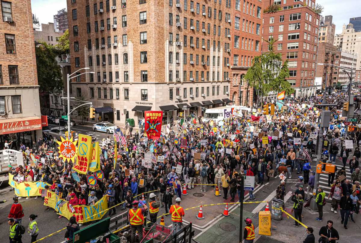 Tens of thousands of New Yorkers peacefully marched from the heart of the Big Apple to Lower Manhattan on Saturday in protest of President Trump and his policies, including the escalation of violence against United States citizens.