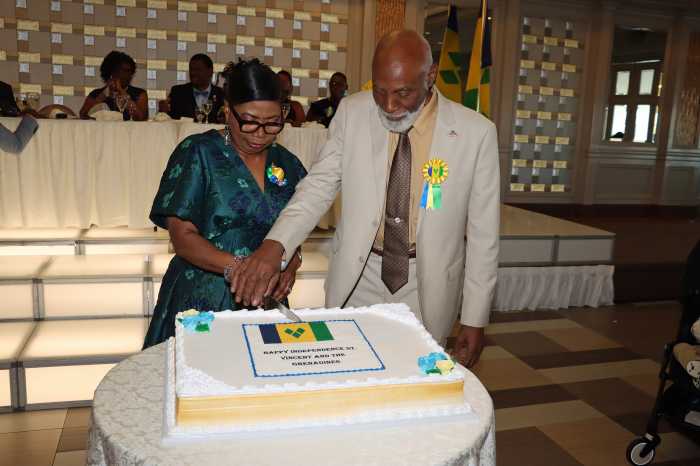 COSAGO President Crispin Friday and Vice President Laverne McDowald-Thompson cut St. Vincent and the Grenadines Independence Anniversary Cake.