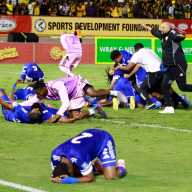 Curacao coach Dean Gorre and players celebrate after they qualify for the World Cup during their match against Jamaica at the National Stadium Independence Park, Kingston, Jamaica on Nov. 18, 2025.