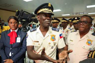 Vladimir Paraison, chief of the National Police, attends a press conference to present weapons and ammunition seized during different operations against gangs, in Port-au-Prince, Haiti, November 28, 2025.