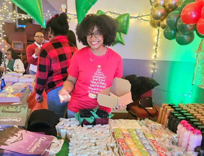 An elf helped to wrap gifts at the Dec. 5 Christmas Village celebration at Liberty Bible Fellowship Church.