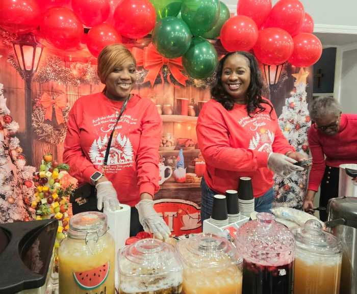 Santa's Elves welcomed celebrants to Liberty Bible Fellowship Church Christmas Village with big smiles and homemade drinks of sorrel, ginger beer, mauby, golden apple juice, and treats, as they entered the lobby area of the sanctuary.