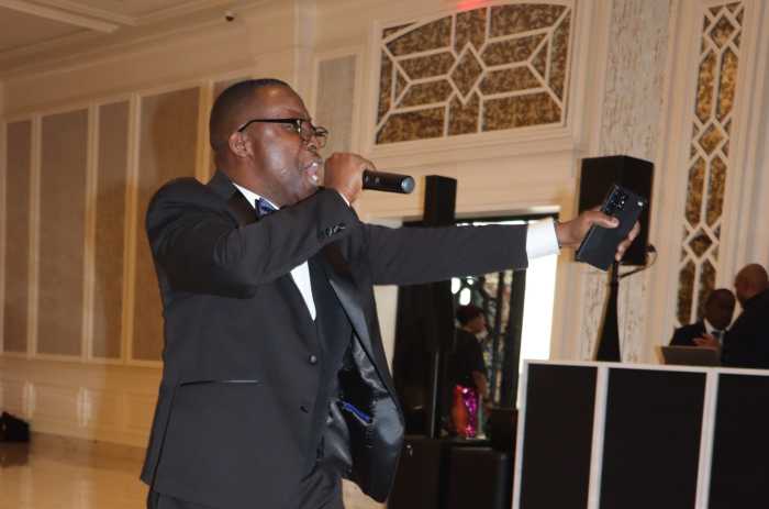 Gerard Placide sings at the VINCI annual pre-Christmas gala.