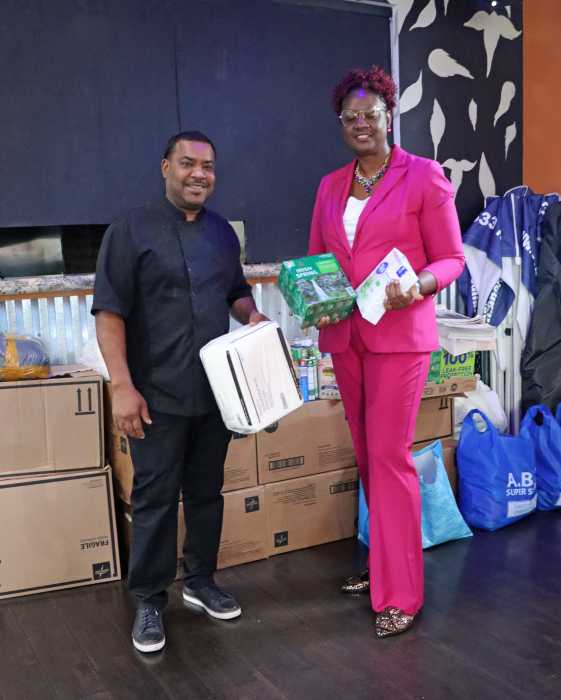Jennifer Horsford-Viechweg and Calvin Sennon display relief supplies.