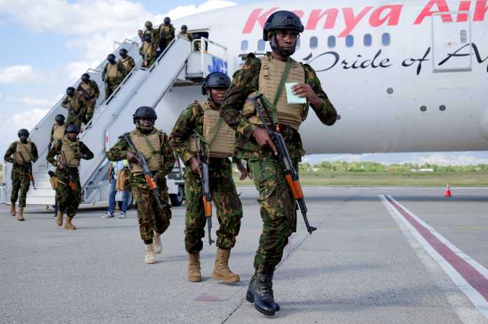 Kenyan police officers disembark in Haiti to join an expanded multinational force with a mandate to fight gangs, at Toussaint Louverture International Airport, in Port-au-Prince, Haiti Dece. 8, 2025.