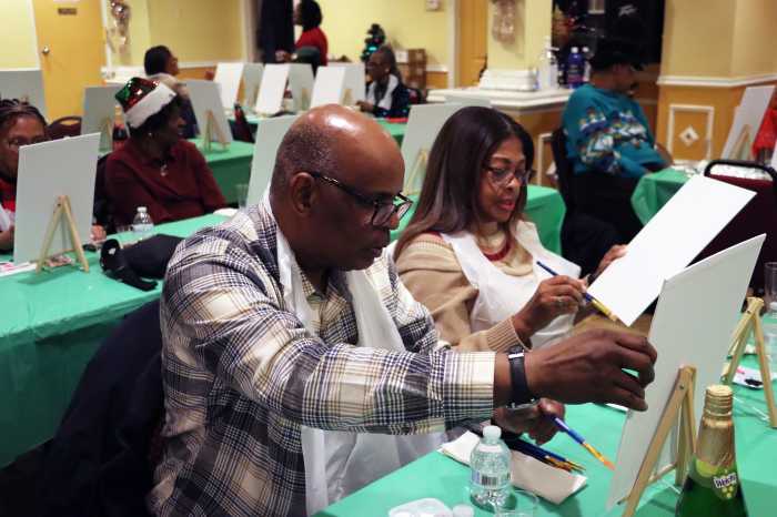 Pastor the Rev. Roger Jackson and wife, First Lady Sis. Kim Jackson, participate in the Sip and Paint event.