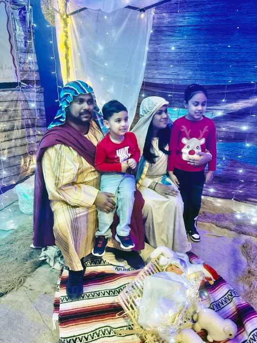 Mary and Joseph, welcome arrivals to the manger where Baby Jesus lay in a crib dressed in swaddling clothes. This Nativity station attracted children, and adults alike at a Christmas Village celebration at Liberty Bible Fellowship Church, in Ozone Park Queens, on Friday, Dec. 5, 2025.